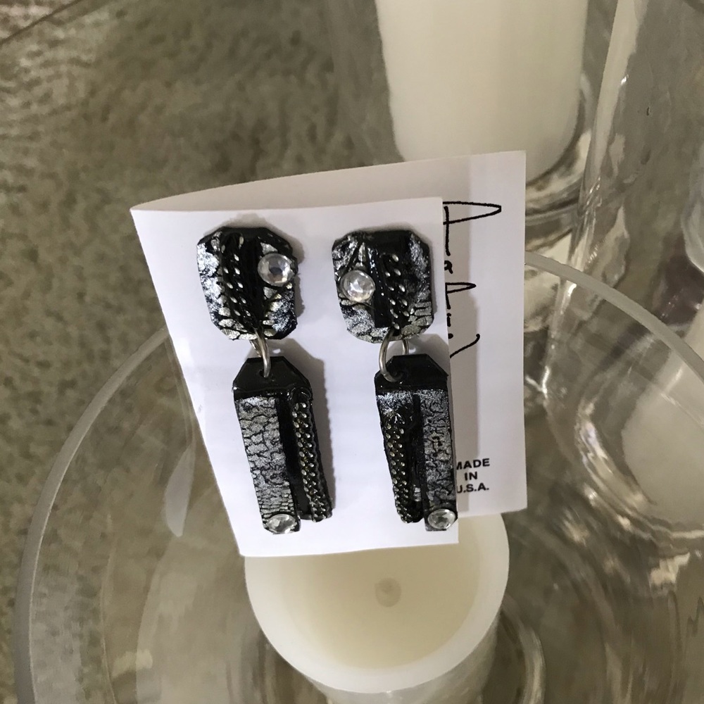 Snakeskin metallic fabric with metal trim.